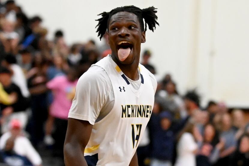 McKinney’s Alex Anamekwe reacts after a dunk in the first half during a boys high school...