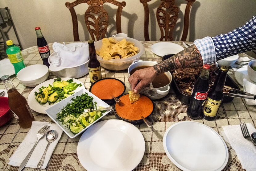 Martin Ibarra tries some salsa before lunch with family in Richardson.