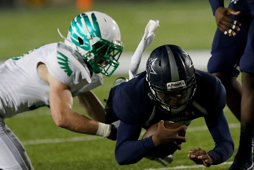  Lake Dallas Falcons Jacob Peppard (left) attempts to tackle Frisco Lone Star Rangers QB...