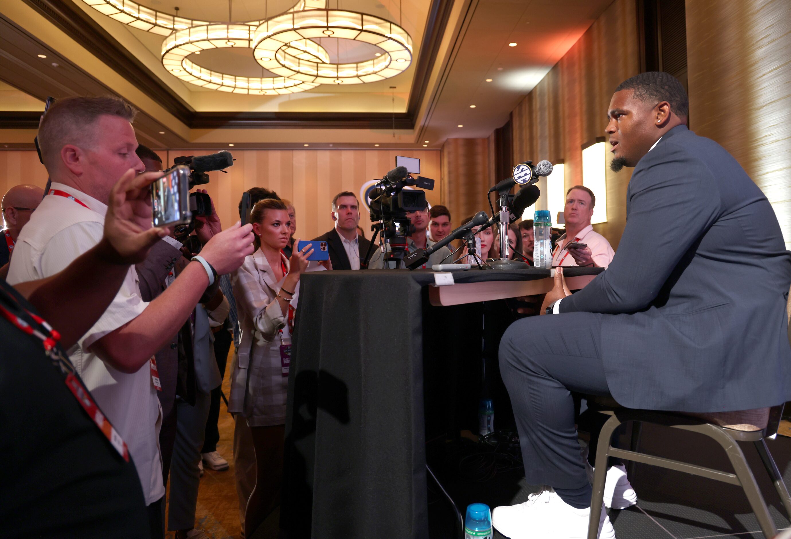 Texas Longhorns offensive tackle Kelvin Brooks Jr. fields questions from media members...