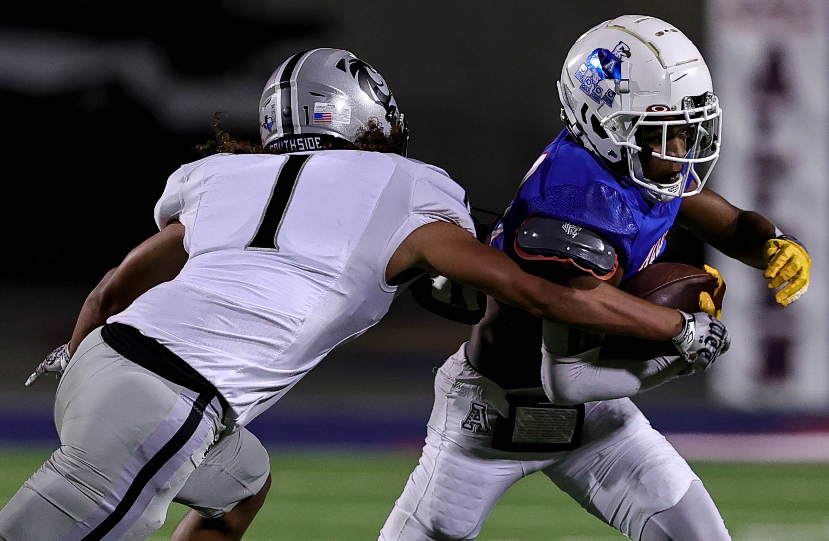 Allen wide receiver Donnell Gee (right) tries to get past Denton Guyer defense back Kaedyn...