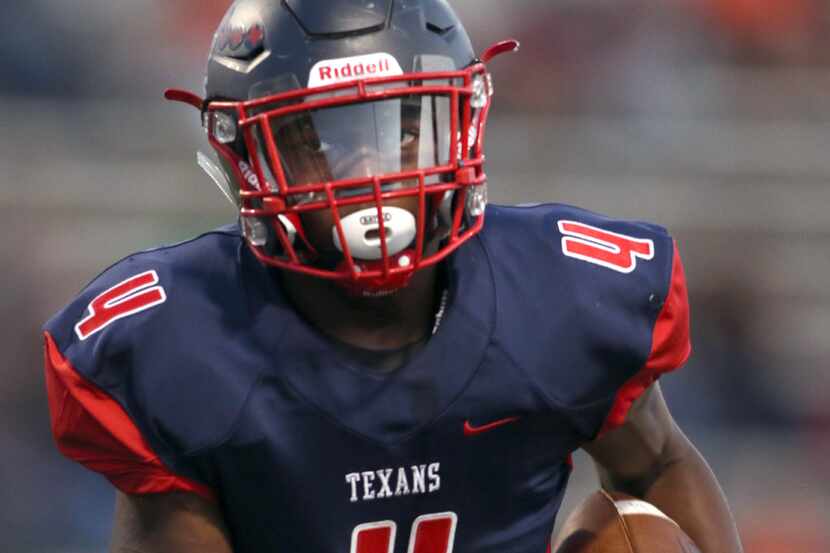 Northwest running back DeMareus Hosey (4) eyes the end zone as he follows a block enroute to...