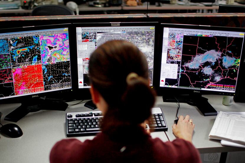 Jennifer Dunn, a meteorologist with the National Weather Service, monitors activity at the...