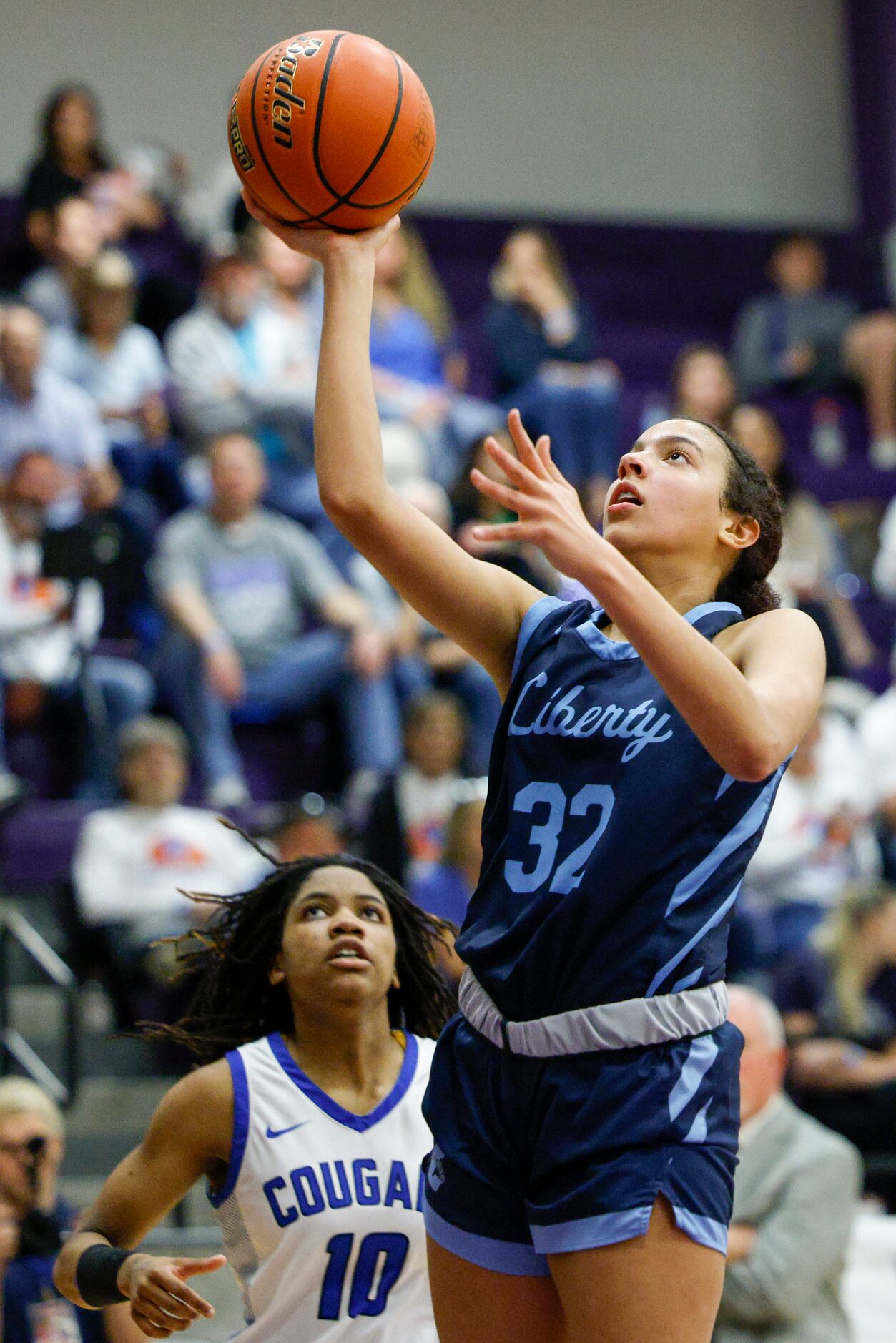 Argyle Liberty Christian forward Jazzy Powell (32) floats a shot towards the basket ahead of...