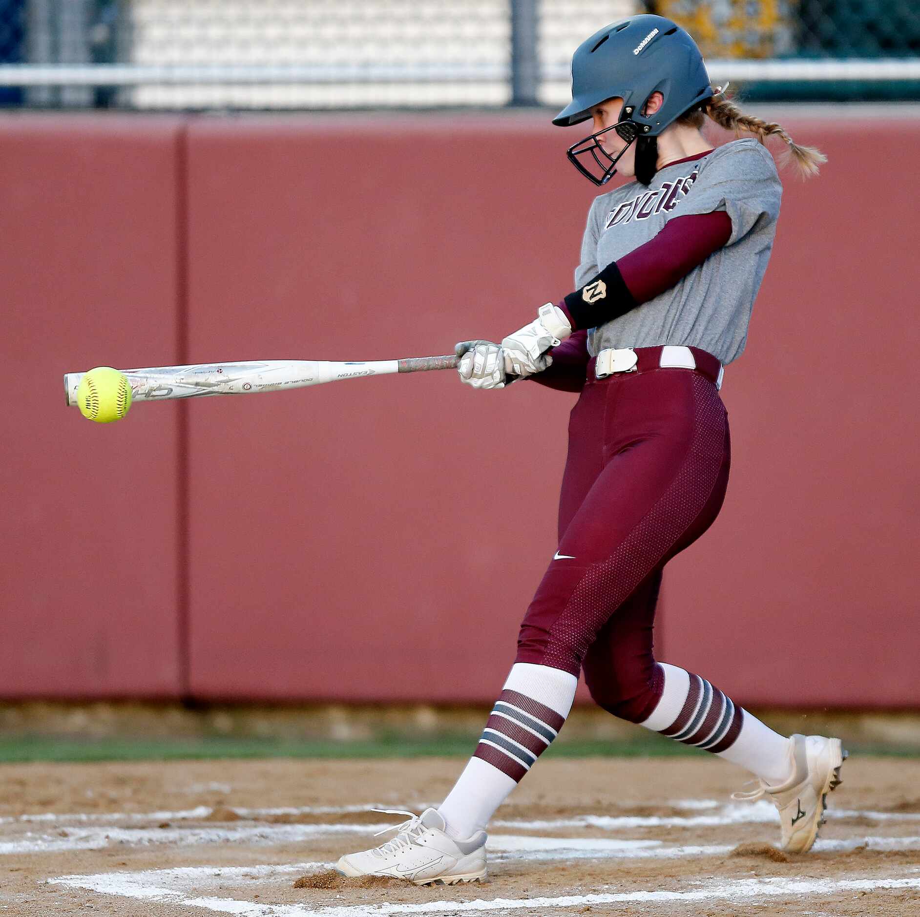 Heritage third baseman Riley Lunsford (10) gets a hit in the second inning as Heritage High...