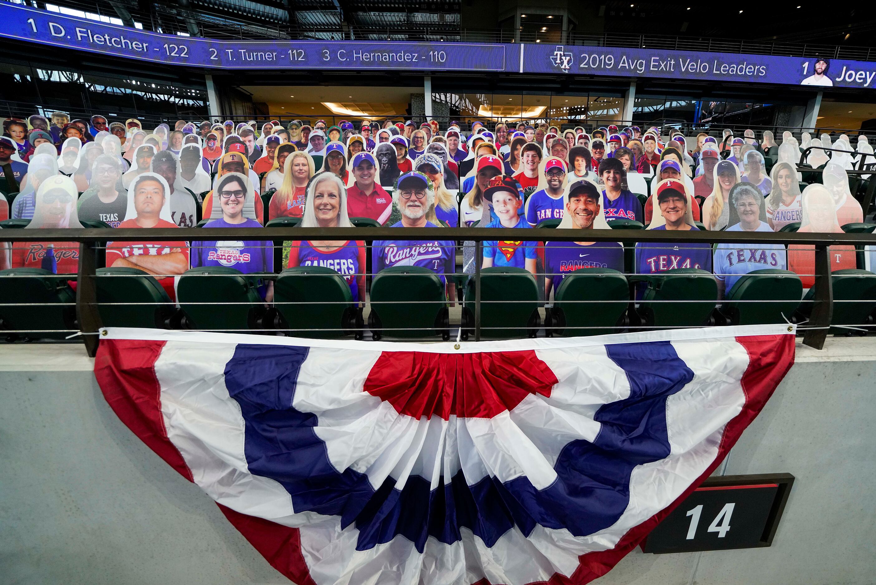 Cutout photos of fans, sold as ÒDoppel RangersÓ are set up in empty seating before as...