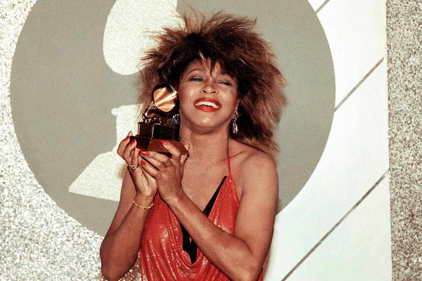 Tina Turner, Pop and R&B vocalist, holds up a Grammy Award, Feb. 27, 1985, in Los Angeles....