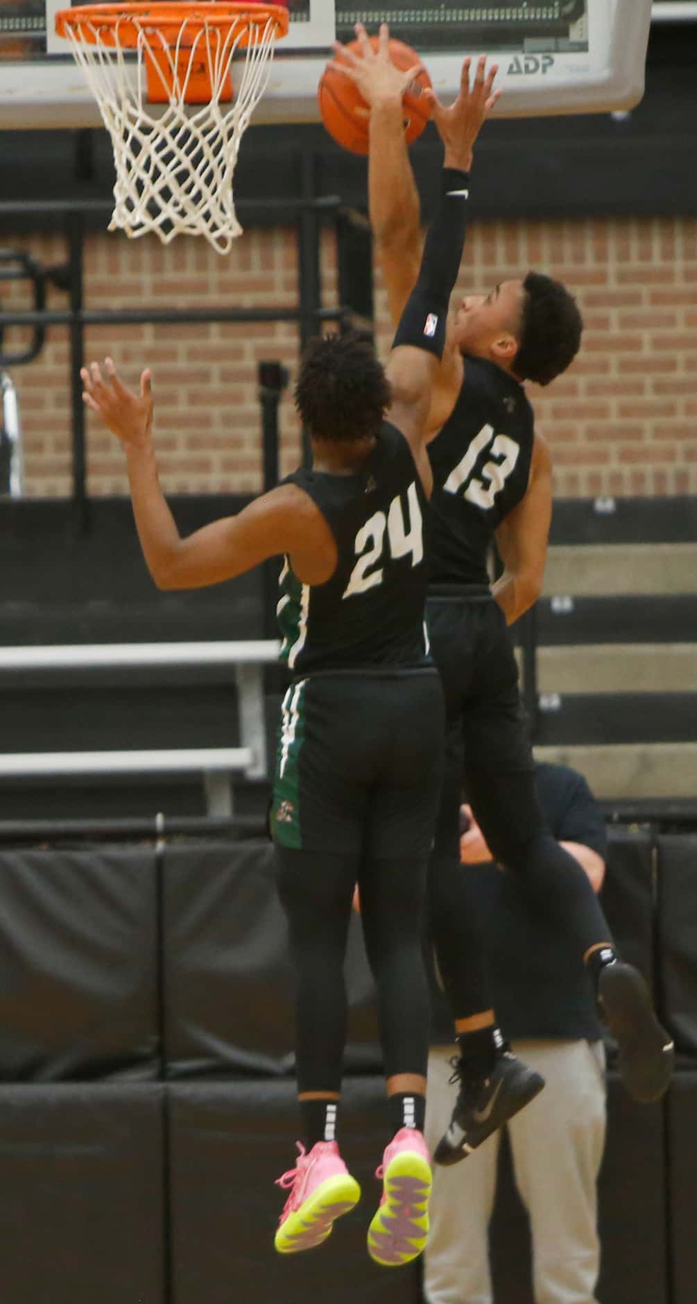 Waxahachie guards Preston Hodge (13) and AB Shorter (24) join efforts to secure a defensive...