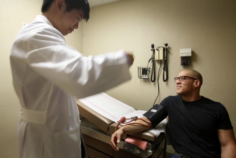 Doyle Yuan, a second-year medical student from UT Southwestern Medical Center, prepared to...