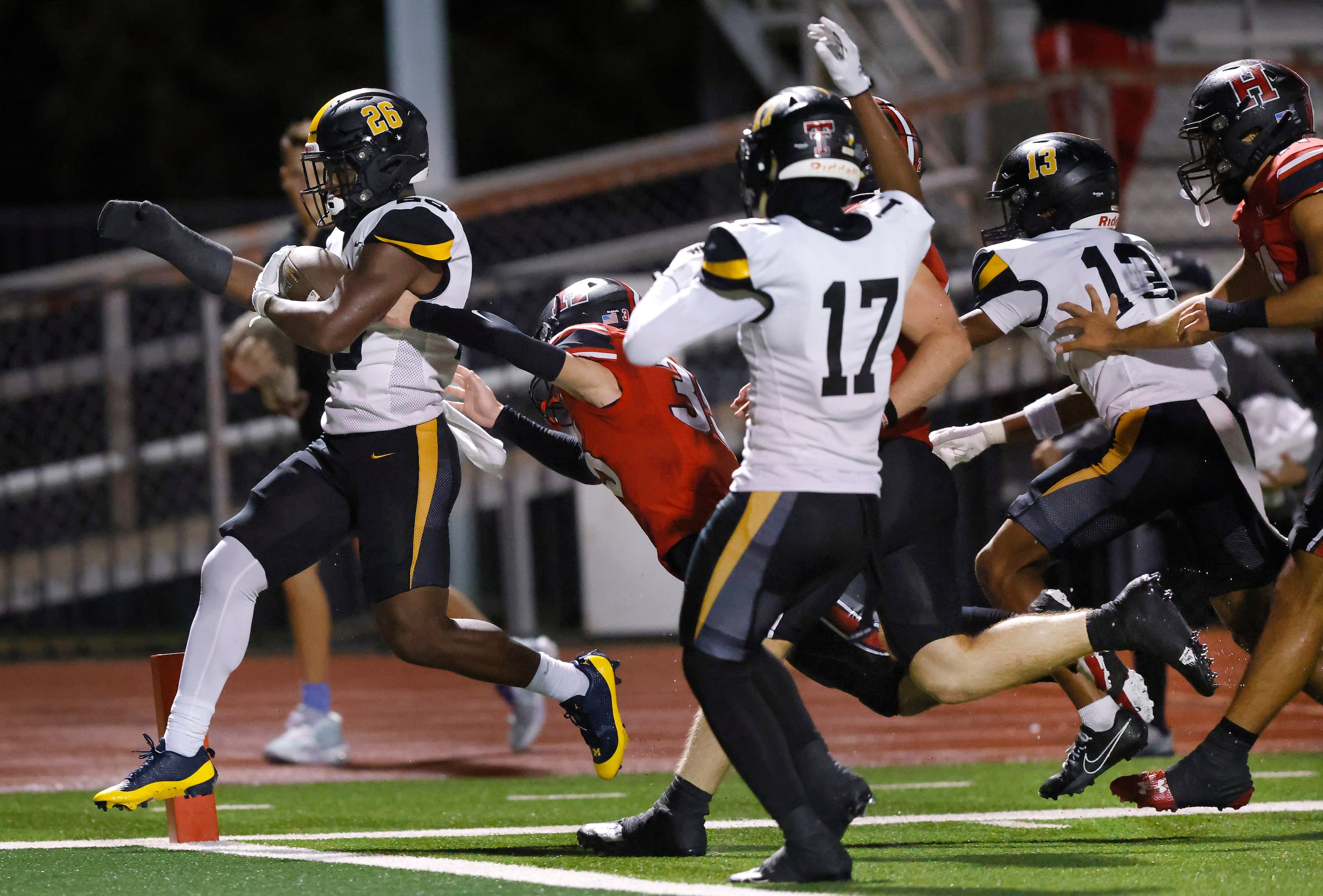 Forney running back Dylan McCann (26) crosses the goal line after breaking several...