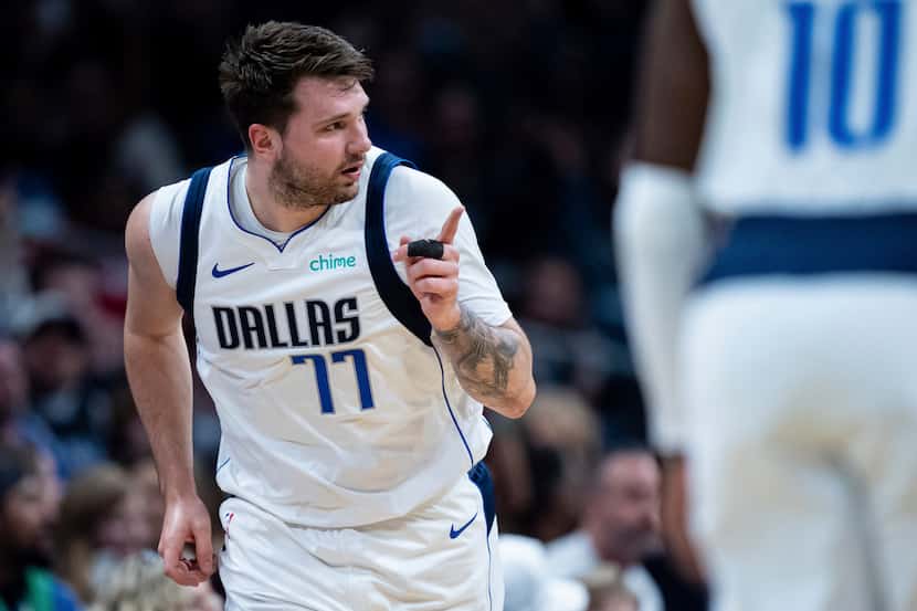 Dallas Mavericks guard Luka Doncic (77) reacts after making a shot during the first half of...