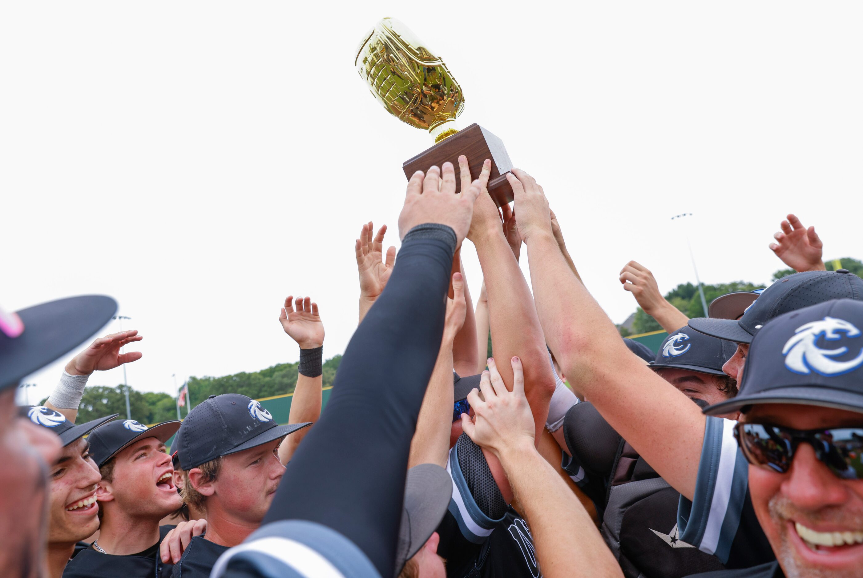 Denton Guyer players cheer after winning a baseball game against Byron Nelson High School on...