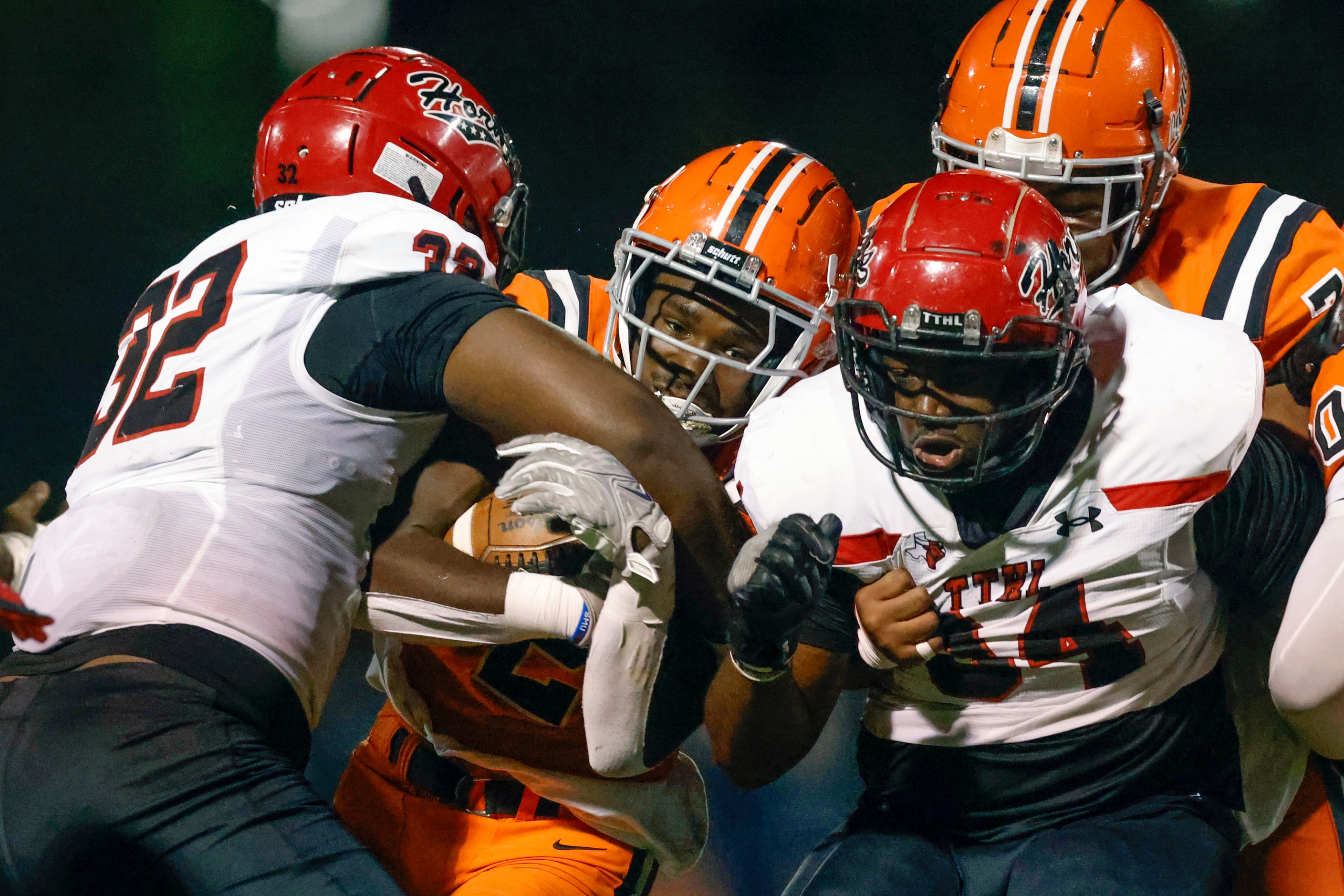 Cedar Hill defensive lineman Jalen Brewster (32) tackles Lancaster running back Izayah Lee...