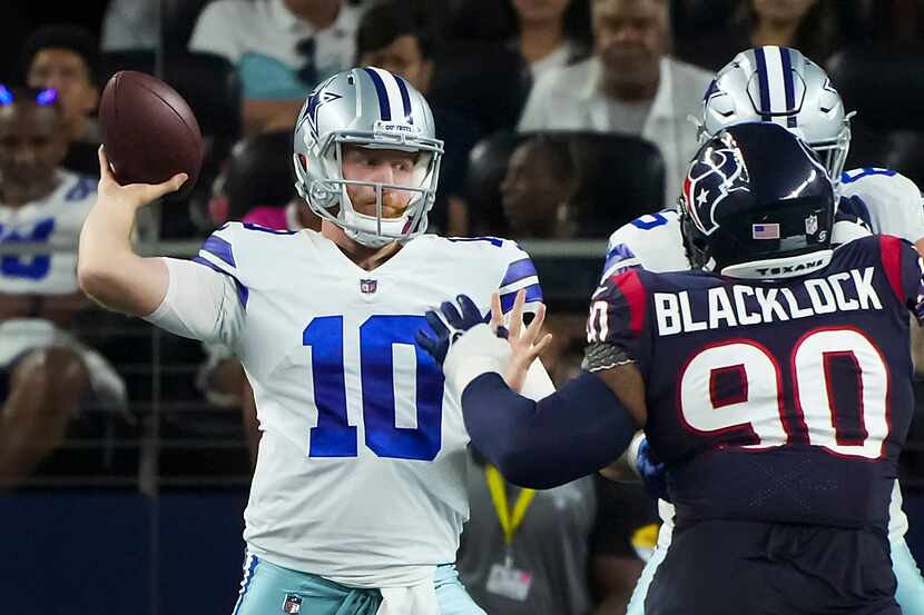 Dallas Cowboys quarterback Cooper Rush (10) throws a pass during the first half of a...