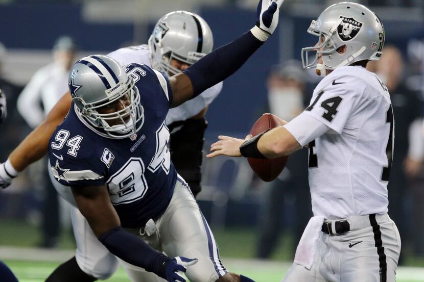 Dallas Cowboys defensive end DeMarcus Ware (94) pressures Oakland Raiders quarterback Matt...