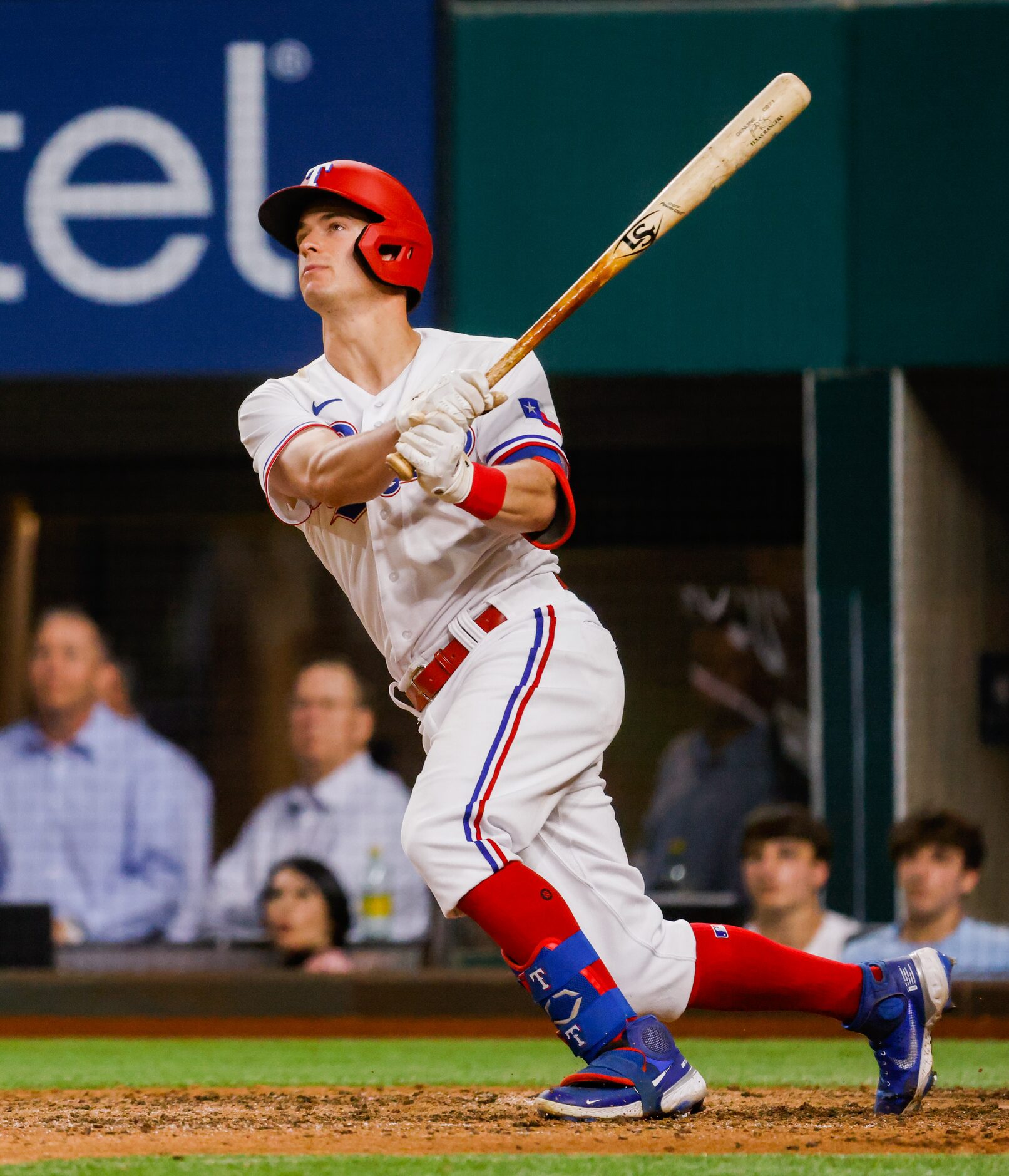 Texas Rangers second baseman Nick Solak (15) hits a homer on a fly ball to left field on a...