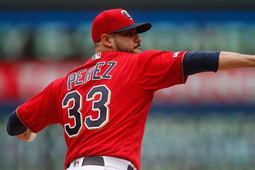 Minnesota Twins pitcher Martin Perez throws against the Tampa Bay Rays in a baseball game...
