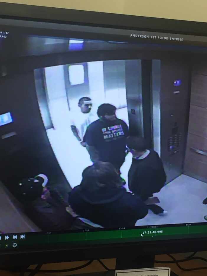 Surveillance footage shows Alfredo Castro in an elevator and standing outside a building.