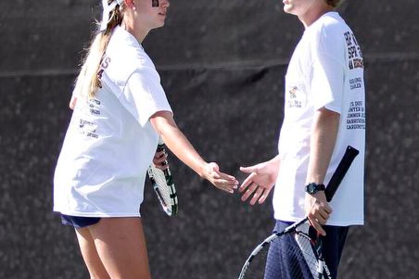 Mixed doubles partners Elizabeth Tedford and Mac McCullough of Highland Park cheer each...