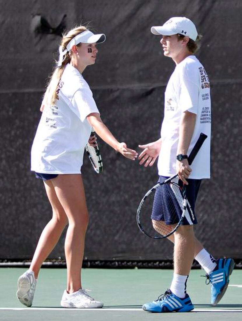 Mixed doubles partners Elizabeth Tedford and Mac McCullough of Highland Park cheer each...