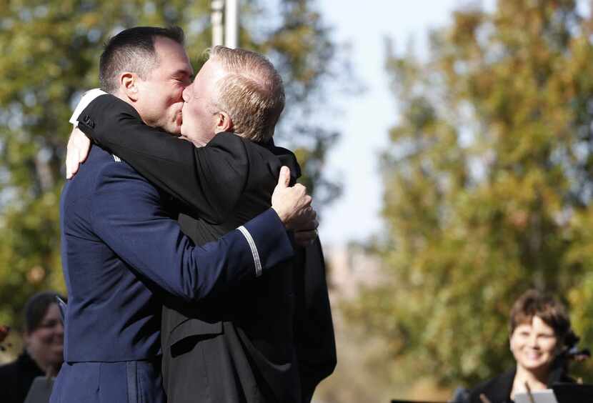 Vic Holmes (left) and Mark Phariss kiss during their wedding at the Westin Stonebriar Hotel...