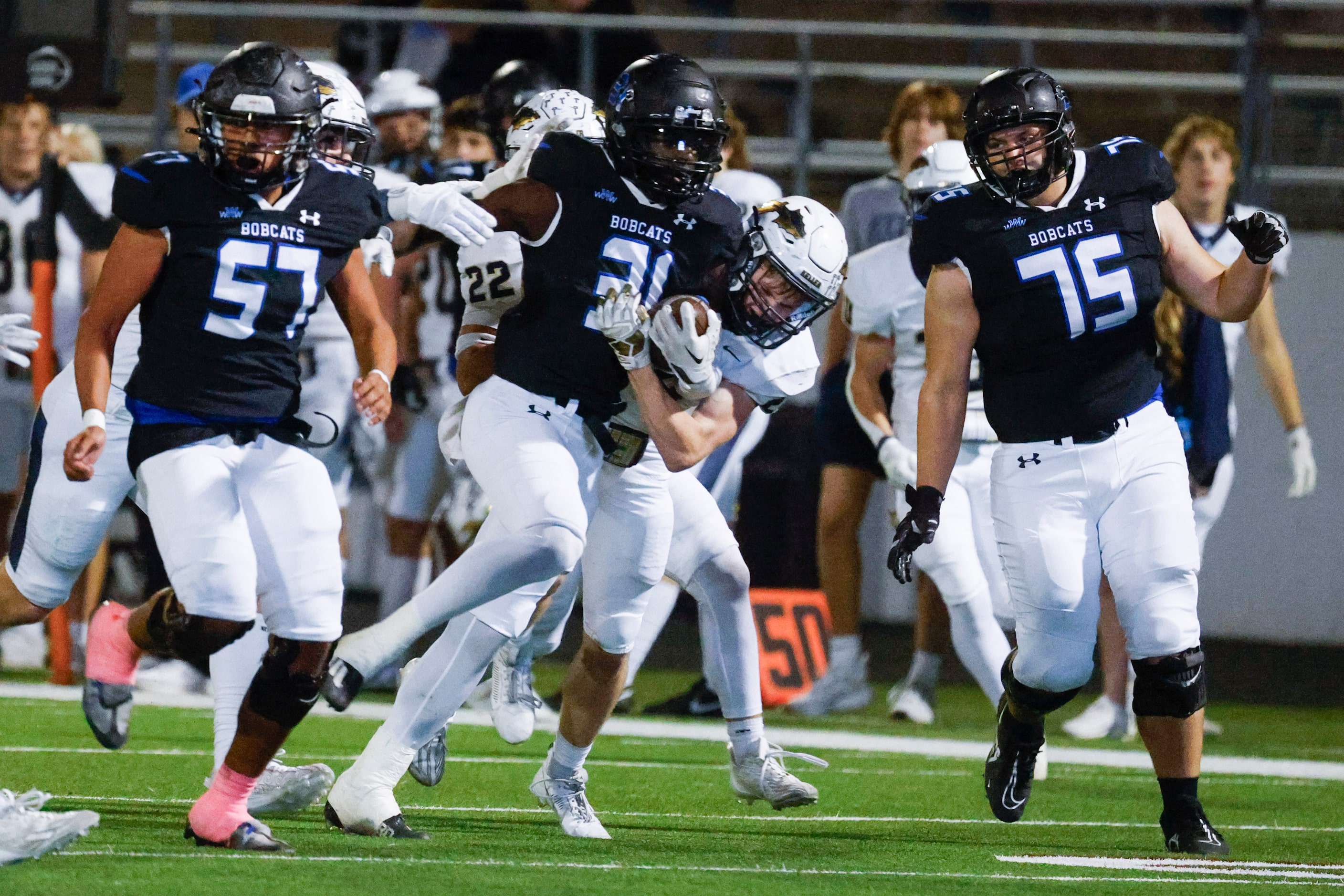 Byron Nelson high’s Manny Mumba (31) gets tackled by Keller high’s TJ Worthy during the...