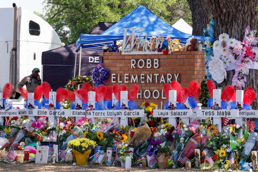 Crosses bear the names of the victims of the Robb Elementary School shooting in Uvalde.