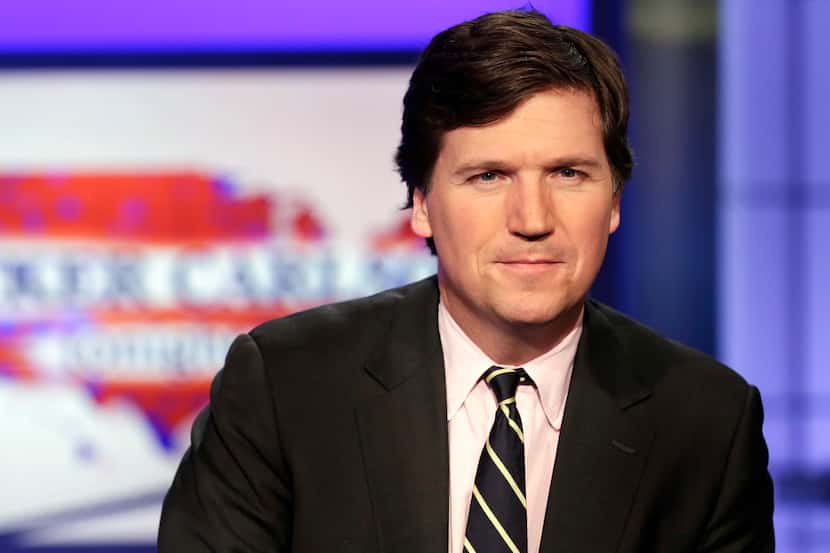 Fox News says it has agreed to part ways with commentator Tucker Carlson, shown in 2017,...