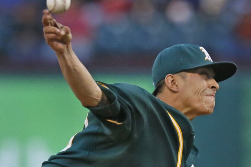 Oakland starting pitcher Jesse Chavez throws a first-inning pitch during the Oakland...