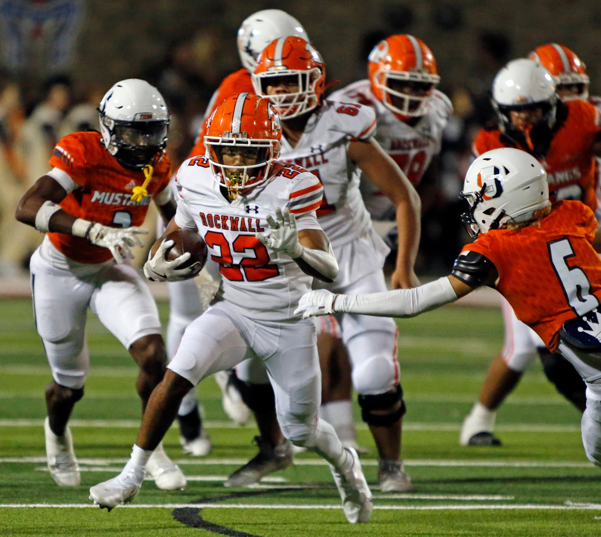 Rockwall High RB AJ Hatcher (22) picks up a first down during the first half of a high...