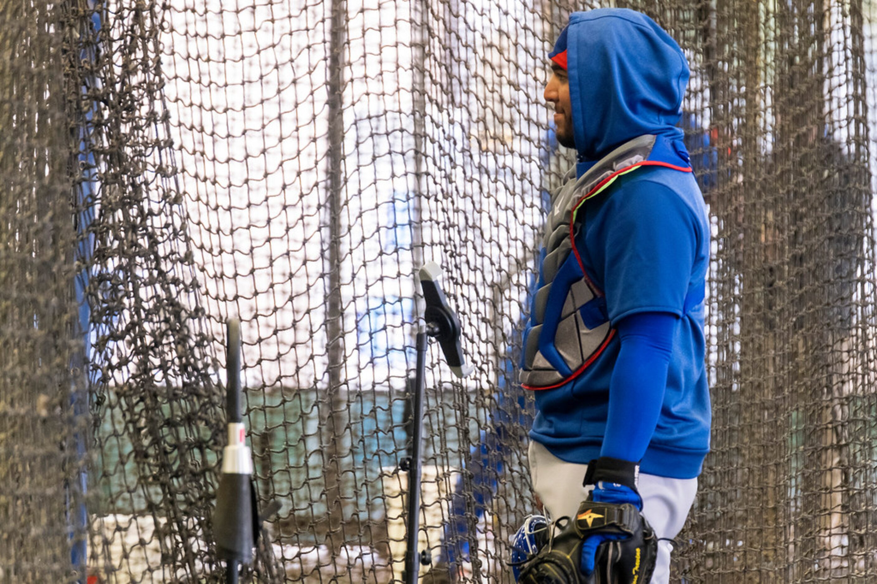 Texas Rangers catcher Jose Trevino works in the batting cages during a spring training...