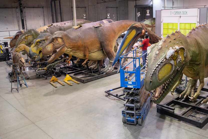 Employees prepared dinosaurs at Billings Productions, an animatronic dinosaur company in...