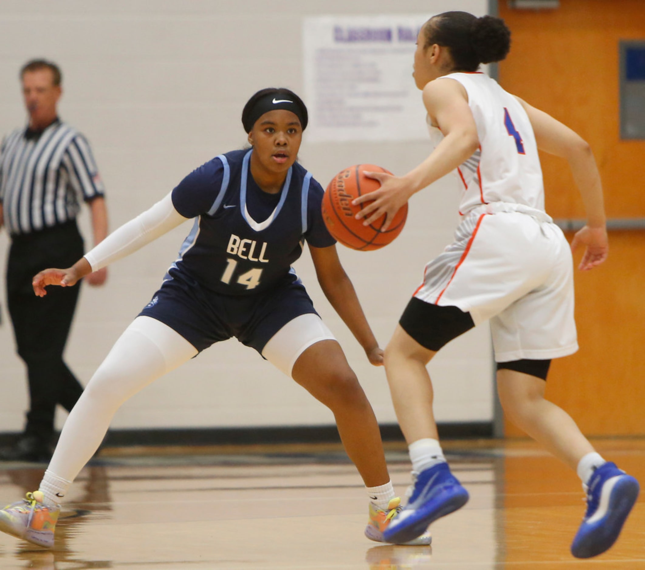 Hurst L.D. Bell guard Kyla Davis (14) defensively matches the moves of Arlington Bowie guard...