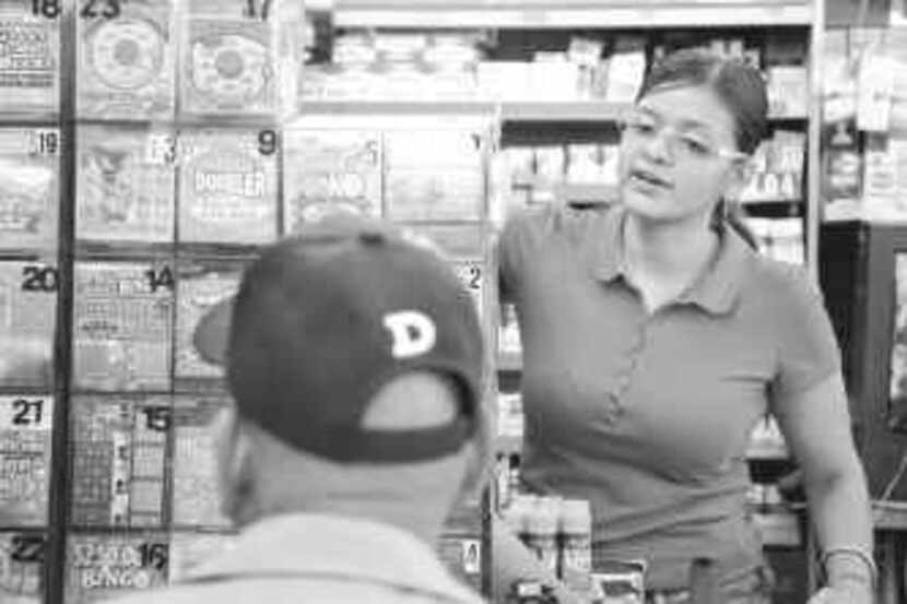 Camelia Walia helped a customer purchasing lottery tickets at a Dallas convenience store in...