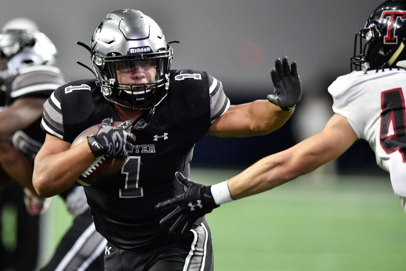 Denton Guyer vs. Amarillo Tascosa.
Guyer running back Kaedric Cobbs (1) stiff-arms Tascosa's...