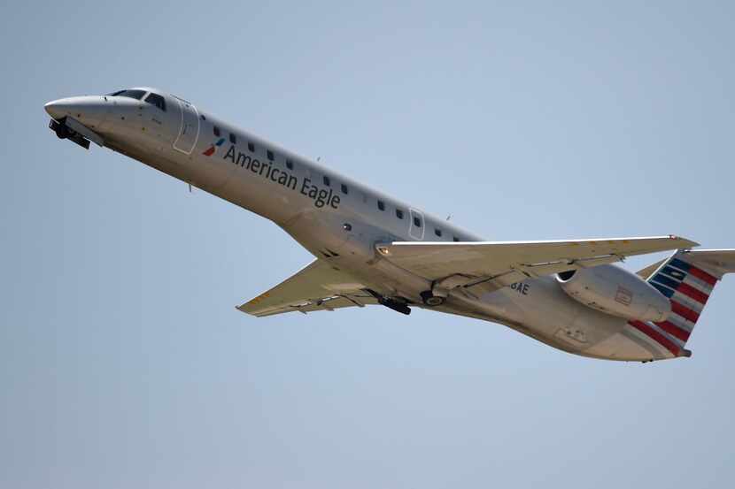 An American Eagle plane takes off at DFW International Airport.