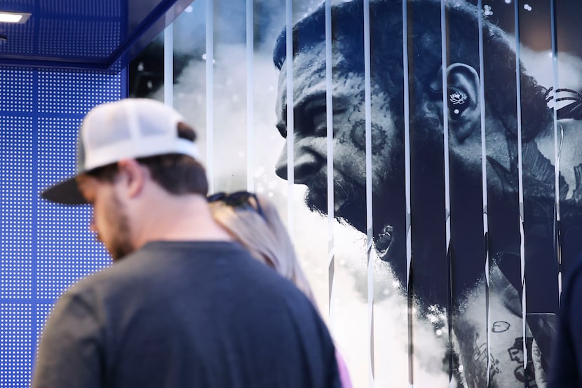 A photo of Post Malone displayed on the wall of the Post-Malone-and-Cowboys-themed Raising...