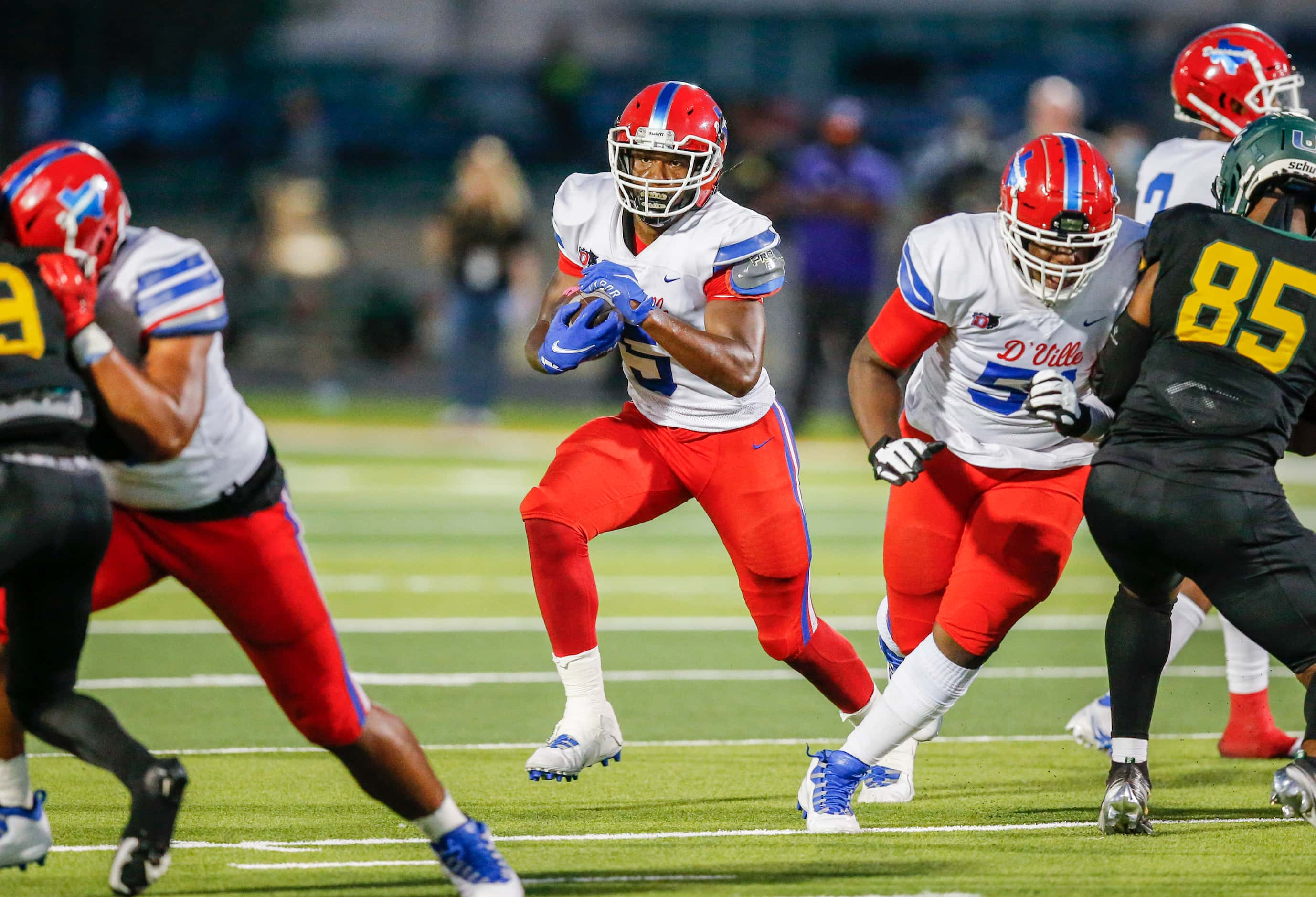 Duncanville senior running back Malachi Medlock (5) carries the ball during the first half...