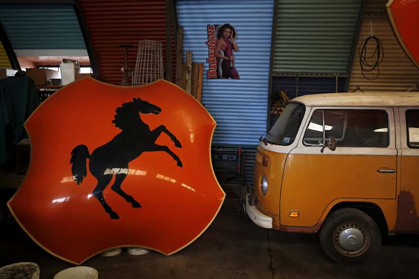 A large shield from the now defunct Bronco Bowl sits in an Oak Cliff warehouse belonging to...