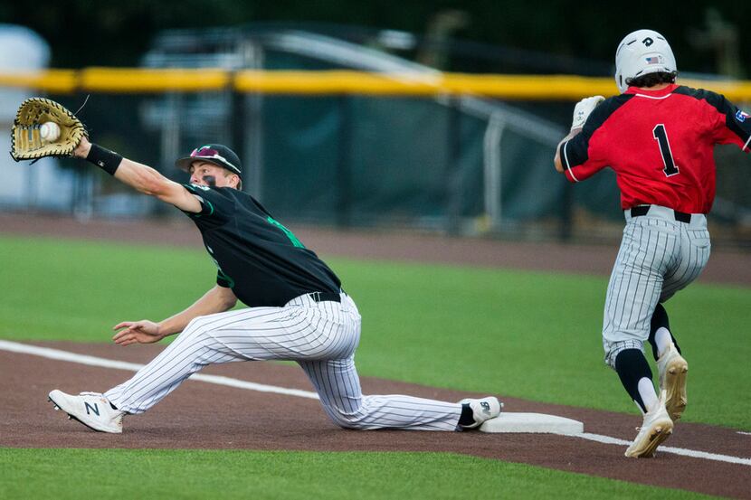 Southlake Carroll's Grant Golomb stretches to catch a throw to first to retire Flower Mound...