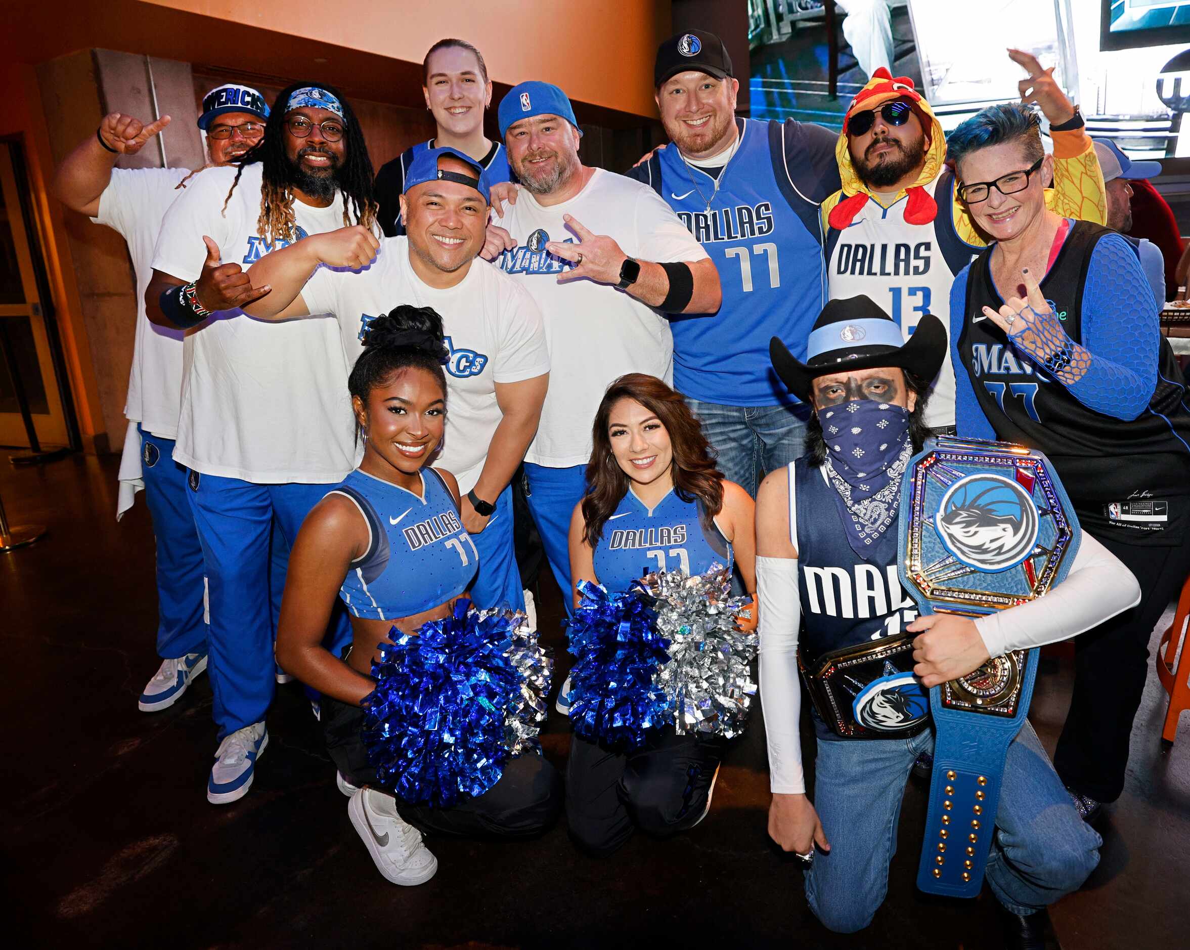 People pose for a photo during a Game 1 watch party of the NBA basketball Western Conference...