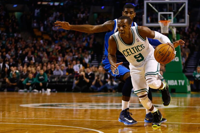 BOSTON, MA - DECEMBER 12:  Rajon Rondo #9 of the Boston Celtics drives to the basket past...