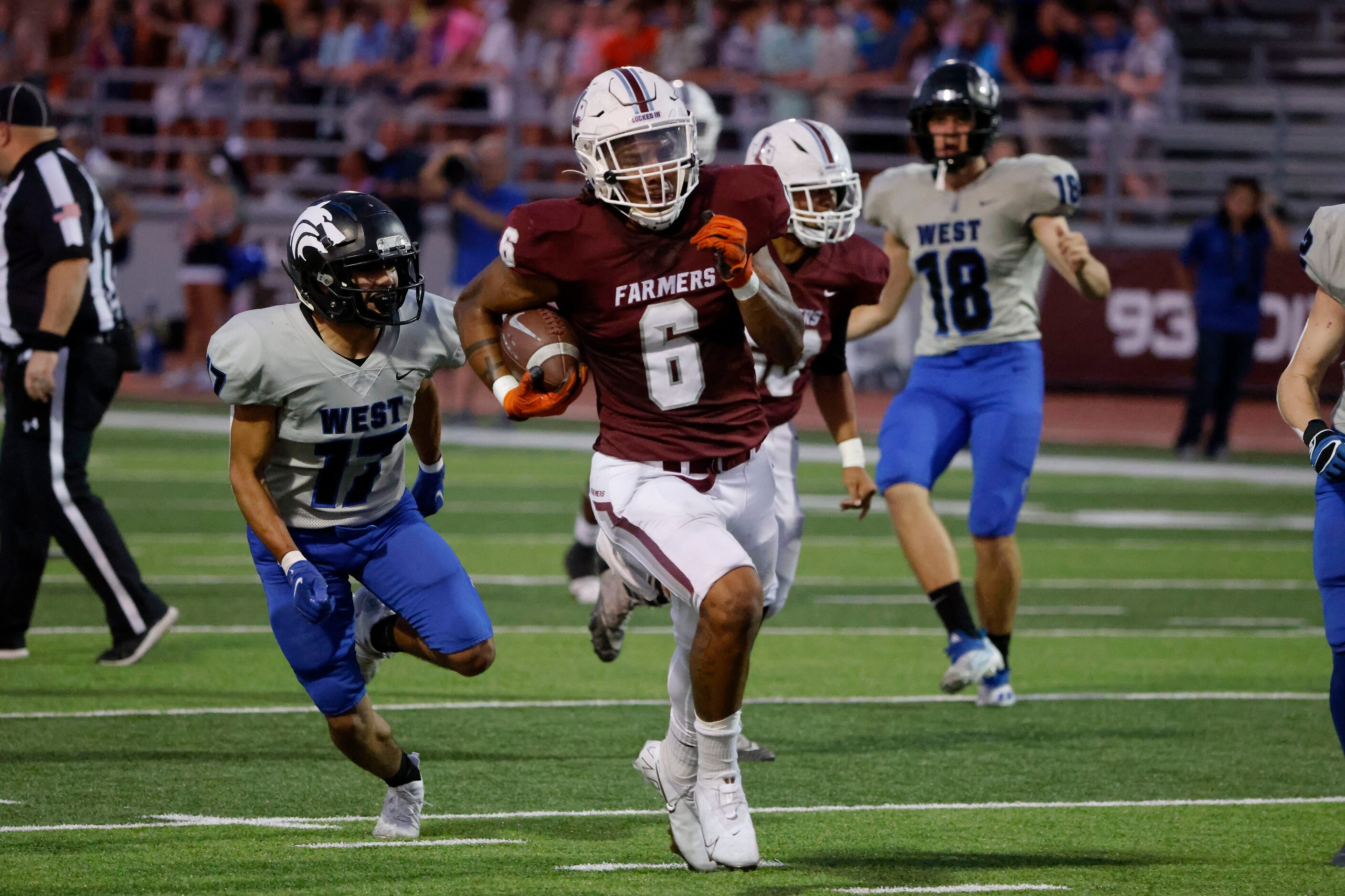 Plano West defender Gael Aguirre (17) chases as Lewisville running back Damien Martinez (6)...