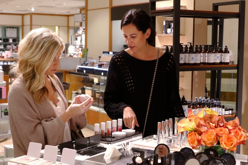 Brooke Burnett (left) and Amanda Miller shop at Neiman Marcus Trending Beauty shop at...