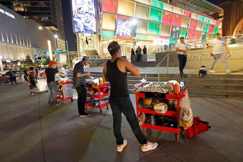 Mexican hot dog street vendors including Hector Maldonado, right, and his brother Alexander...