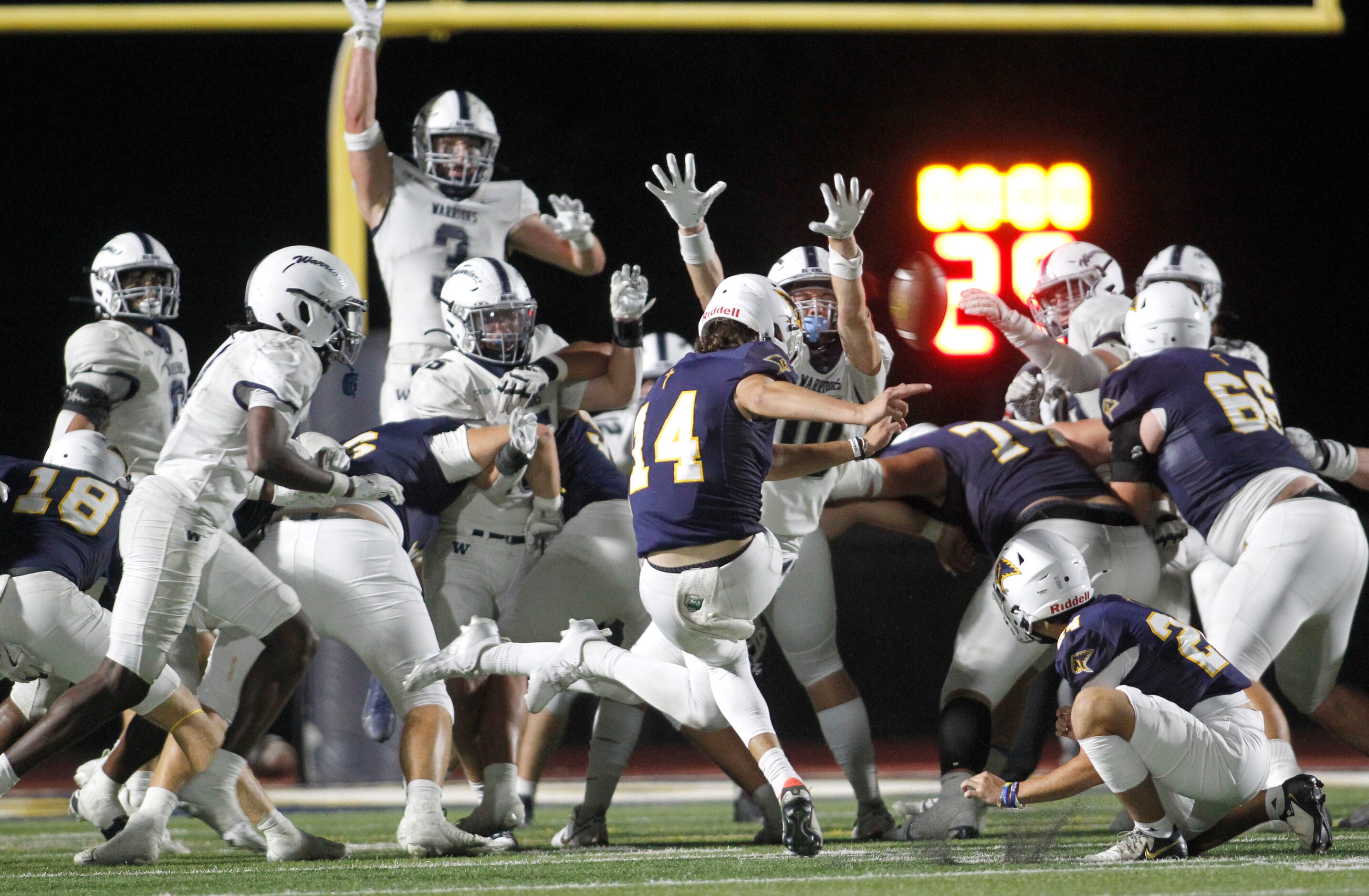 Plano Prestonwood Christian place kicker Justin Dewers (14) attempts a game-tying field goal...