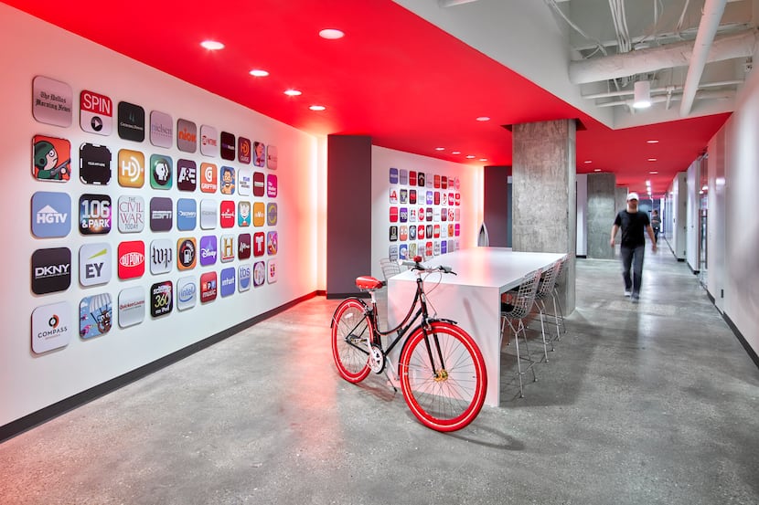 In the main lobby of its Addison headquarters, Bottle Rocket displays the corporate logos of...