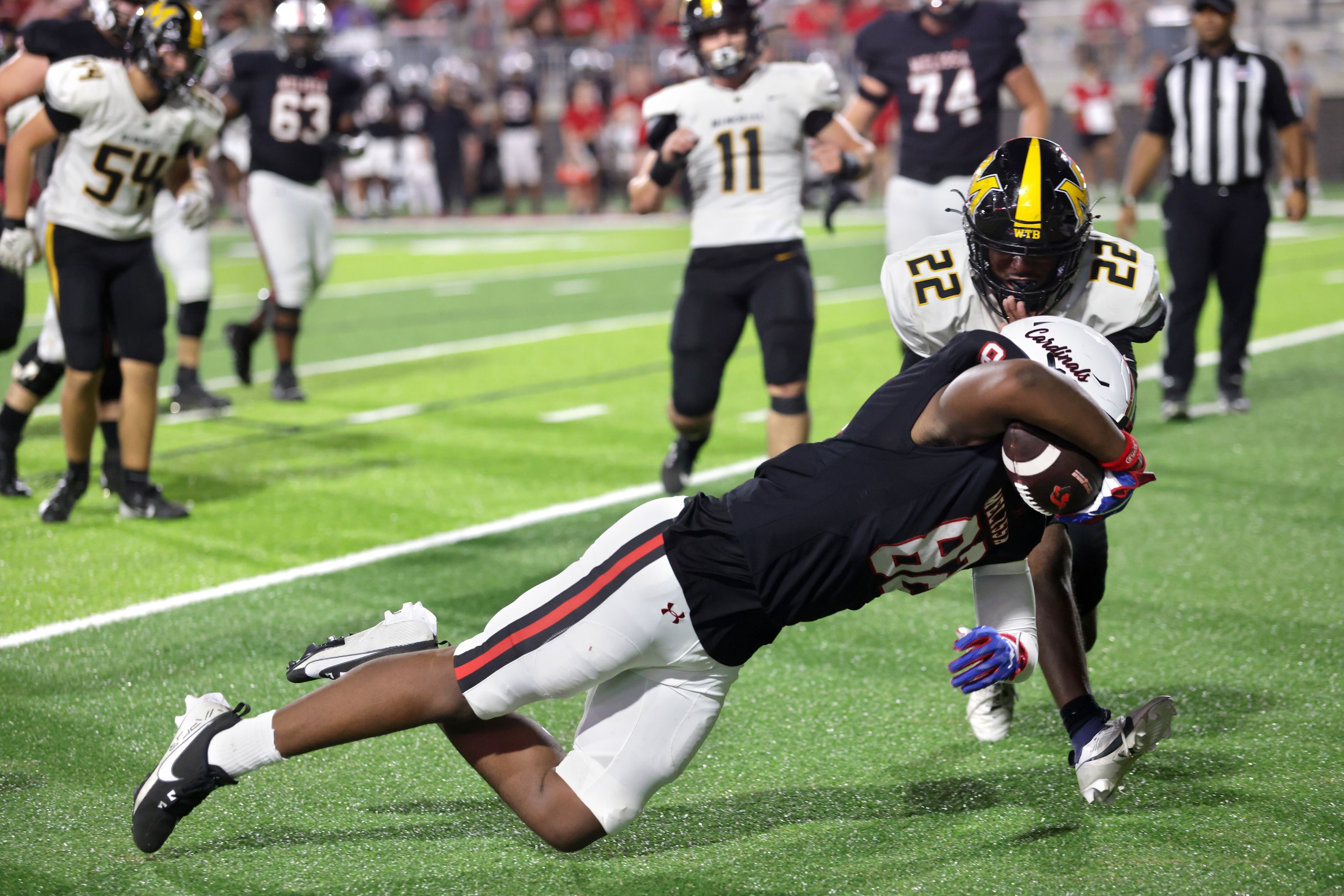 Melissa player #82 Reese Carter comes up just short of a touchdown during a dive as Memorial...