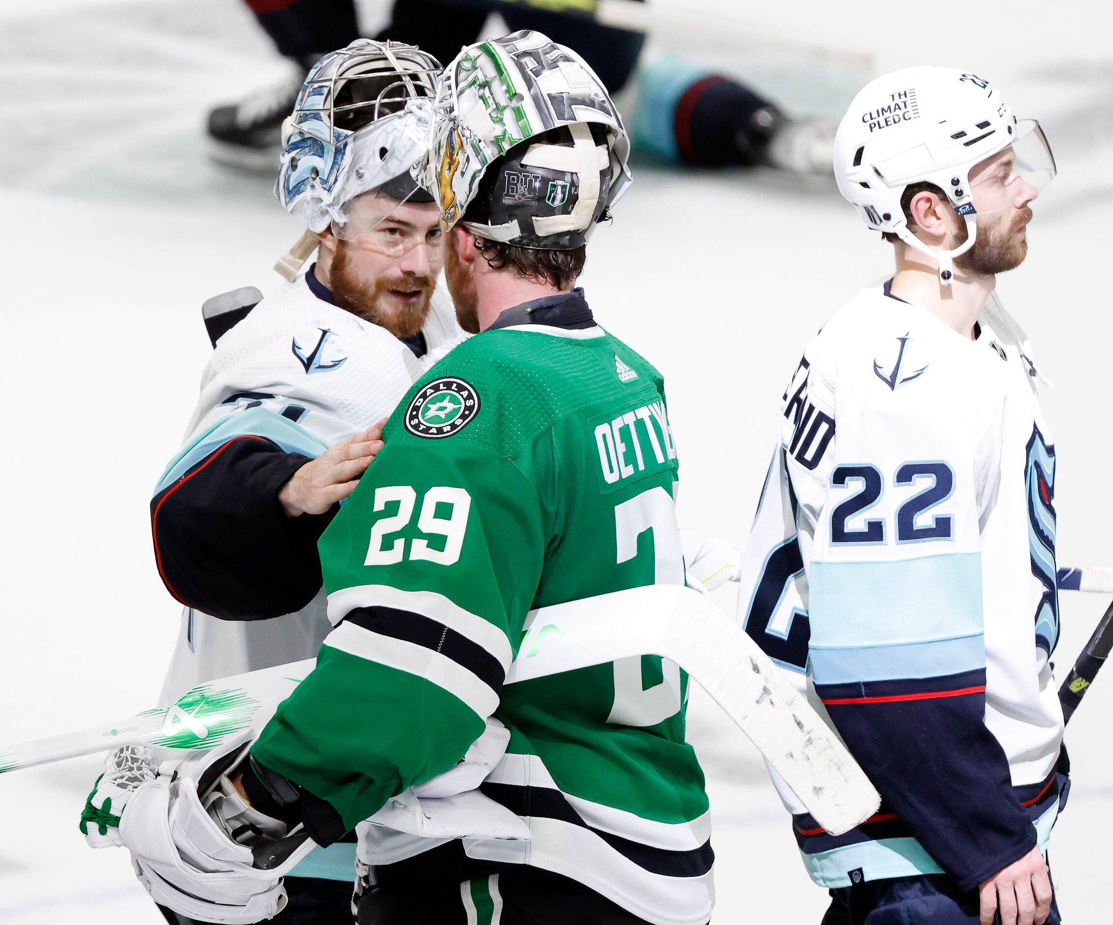 Seattle Kraken goaltender Philipp Grubauer (31) congratulates Dallas Stars goaltender Jake...