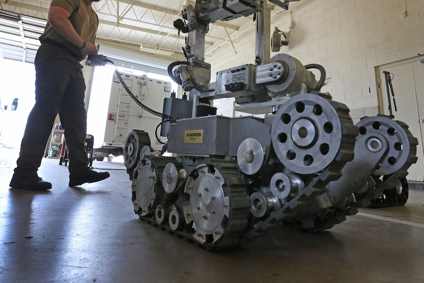 Garland Police Officer Robby Shreves operates the department's bomb robot on Tuesday, May...